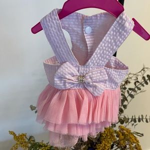 Pink striped dress with tutu and a bow